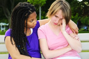 Teenager consoling her friend